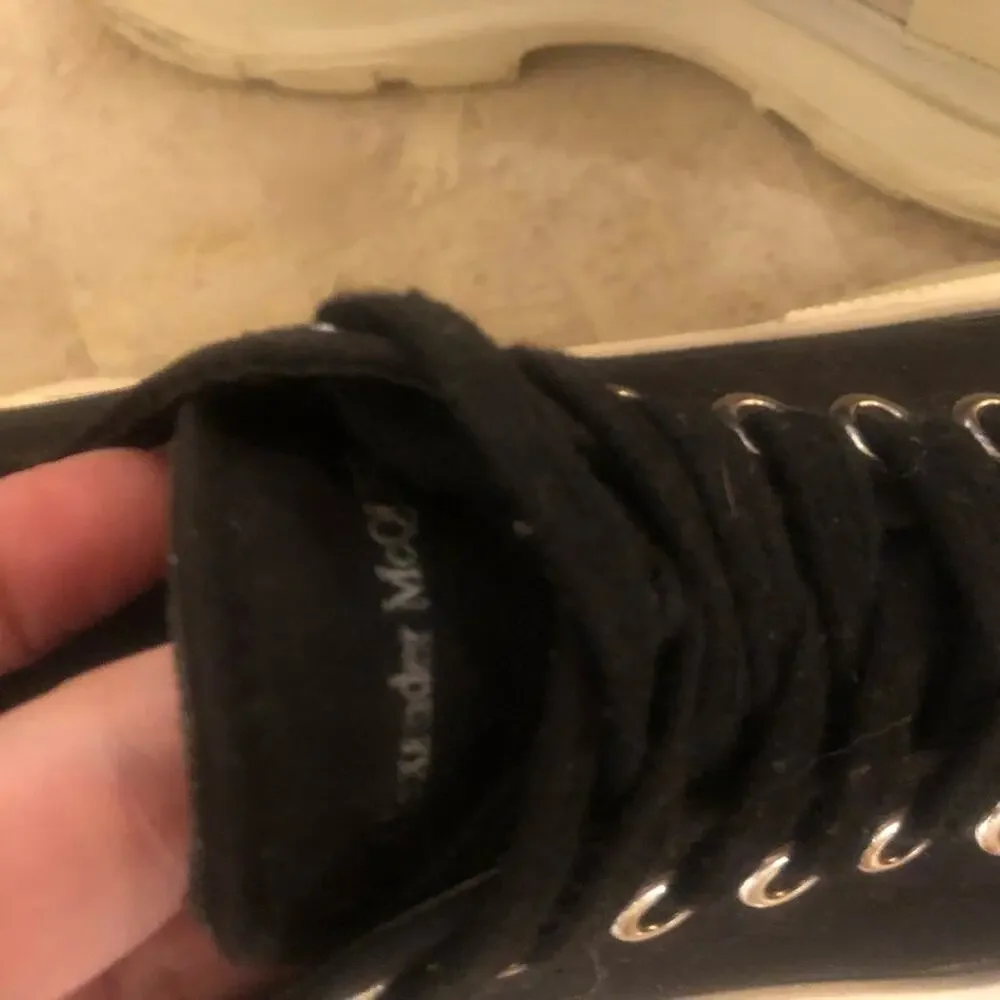 Alexander McQueen black and white platform chucks.